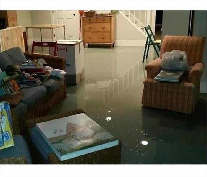 A finished basement is flooded after a storm