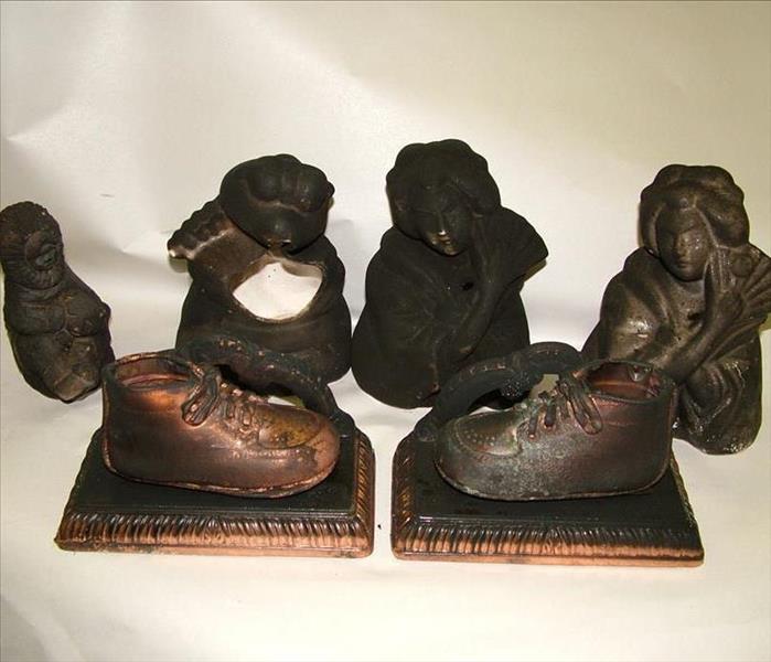 Valuable items are covered in soot after a fire.