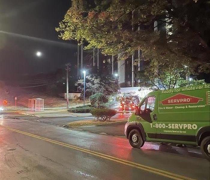 SERVPRO truck outside of a multi-family building after a fire.